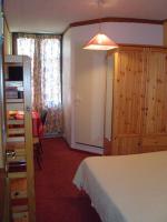 Llit o llits en una habitaci&oacute; de Hotel des Alpes