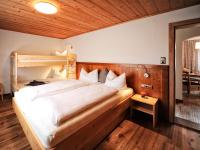 Posteľ alebo postele v izbe v ubytovaní Appartements & Chalets Wiesenruh