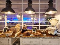 a bakery with a counter with bread and pendant lights at Delamar 4*Sup-Adults only (18+) in Lloret de Mar