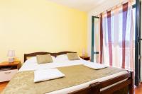 Postel nebo postele na pokoji v ubytování Apartments Marija