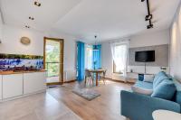 Telewizja i/lub zestaw kina domowego w obiekcie Gdansk Comfort Apartments Bursztynowa