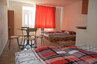 A bed or beds in a room at Penzion Atlas