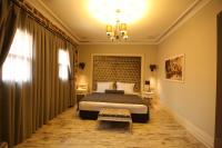 A bed or beds in a room at L'Agora Old Town Hotel & Bazaar