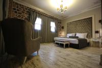 A bed or beds in a room at L'Agora Old Town Hotel & Bazaar