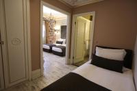 A bed or beds in a room at L'Agora Old Town Hotel & Bazaar