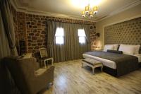 A bed or beds in a room at L'Agora Old Town Hotel & Bazaar