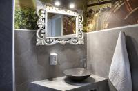 a bathroom with a bowl sink and a mirror at Voulamandis House in Kambos