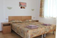 Postel nebo postele na pokoji v ubytování Hotel Radik