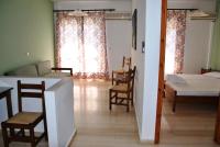 A bed or beds in a room at Filoxenia Hotel & Apartments