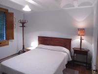 A bed or beds in a room at Cal Son