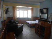 Televízia a/alebo spoločenská miestnosť v ubytovaní Hotel Admitos