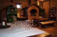 a table with wine glasses on a white table cloth at Guest House Stara Baranja in Kneževi Vinogradi