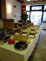 a buffet line with many different types of food at Il Falco E La Volpe in Settimo Vittone