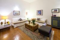 A seating area at At Kalsa Quiet Flowered Terrace! Free Parking! Ideal for remote working!