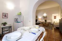 A bed or beds in a room at At Kalsa Quiet Flowered Terrace! Free Parking! Ideal for remote working!