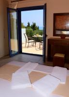 Posteľ alebo postele v izbe v ubytovaní Villa Nostos