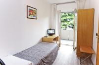Łóżko lub łóżka w pokoju w obiekcie Hotel Rubino
