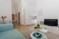 TV a/nebo společenská místnost v ubytování Apartment Flynn