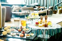 a table filled with different types of desserts and drinks at The Prince Gallery Tokyo Kioicho, a Luxury Collection Hotel in Tokyo