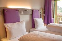 Posteľ alebo postele v izbe v ubytovaní Explorer Hotel Zillertal