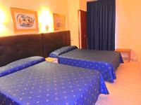 Posteľ alebo postele v izbe v ubytovaní Hostal Bonavista
