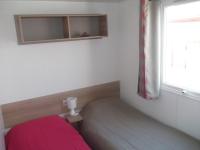 Łóżko lub łóżka w pokoju w obiekcie Mobil Home Valras Plage