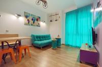 Televízia a/alebo spoločenská miestnosť v ubytovaní Apartamentos Momas La Casa De Mamá
