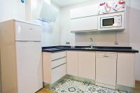 Kuchyňa alebo kuchynka v ubytovaní Apartamentos Momas La Casa De Mamá