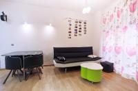 Televízia a/alebo spoločenská miestnosť v ubytovaní Apartamentos Momas La Casa De Mamá