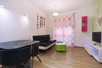 Televízia a/alebo spoločenská miestnosť v ubytovaní Apartamentos Momas La Casa De Mamá