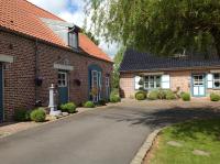 a brick house with a driveway in front of it at Côte d&#39;Opale - La Ferme des Saules in Millam