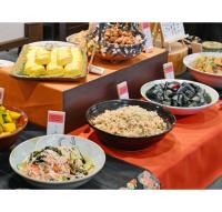 a buffet with bowls of food on a table at Tokyu Stay Kyoto Sanjo-Karasuma in Kyoto
