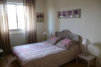 a bedroom with a bed and a window at L&#39;appartement du Haut Plessis in Blois