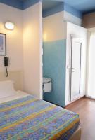 Posteľ alebo postele v izbe v ubytovaní Hotel Fra I Pini