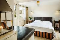 Palazzo Firenze by Baglioni Hotels & Resortsにあるベッド