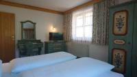 Postel nebo postele na pokoji v ubytování Appartementhotel Hechenberg