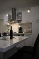 Kuchyň nebo kuchyňský kout v ubytování Apartments Holiday Baška Voda