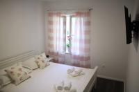 Postel nebo postele na pokoji v ubytování Apartments Holiday Baška Voda