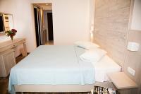 Postel nebo postele na pokoji v ubytování Zeus Hotel