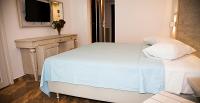 Postel nebo postele na pokoji v ubytování Zeus Hotel