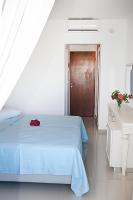 Postel nebo postele na pokoji v ubytování Zeus Hotel