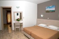 Postel nebo postele na pokoji v ubytování Zeus Hotel