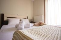 Posteľ alebo postele v izbe v ubytovaní Keramoti Luxury Apartments