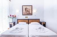 Postel nebo postele na pokoji v ubytování Creta Aquamarine Hotel