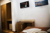 TV a/nebo společenská místnost v ubytování Zeus Hotel
