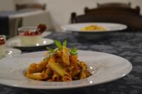 a white plate of pasta on a table at Bosco Ciancio in Biancavilla