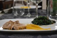 a plate of food with meat and vegetables on a table at Bosco Ciancio in Biancavilla
