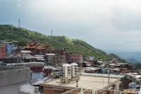 a view of a city with a mountain in the background at Cen Pin B&amp;B in Jiufen