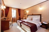 A bed or beds in a room at Best Western Plus Bristol Hotel