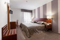 Postel nebo postele na pokoji v ubytování Hotel Marivella